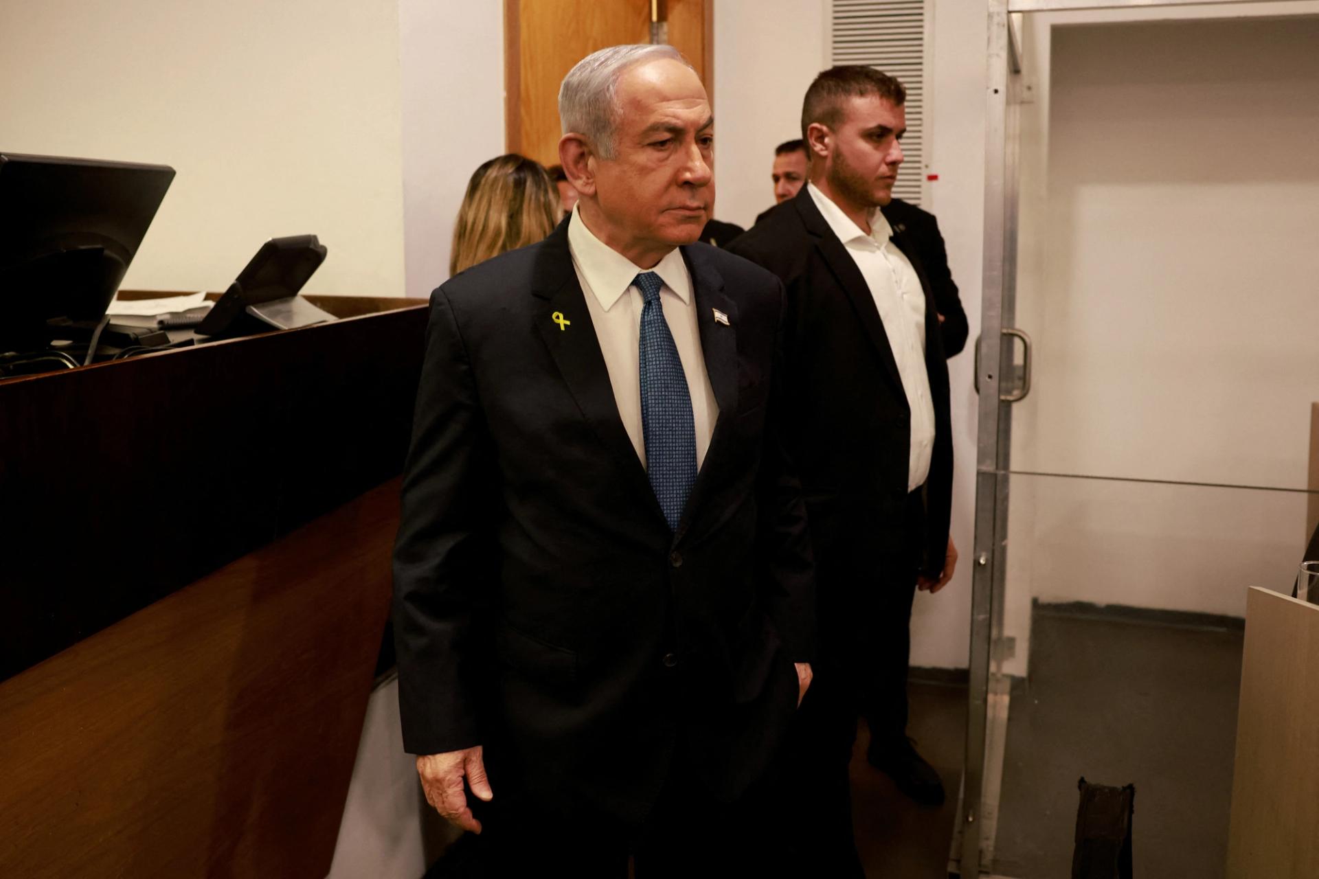 Netanyahu enters the district court in Tel Aviv at the start of his hearing on corruption charges.