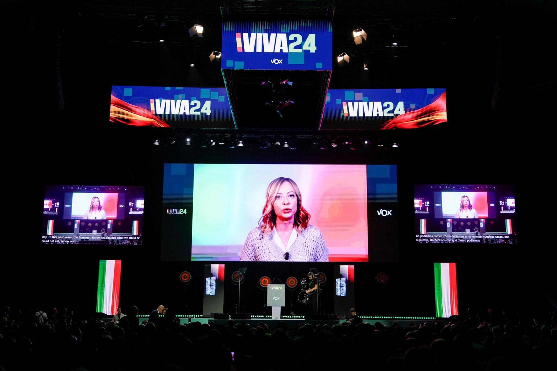 Italian Prime Minister Giorgia Meloni speaks via video link during a rally organised by the Spanish far-right Vox party ahead of the European elections, with various far-right leaders including Argentina's president Javier Milei, in Madrid, Spain, May 19, 2024.