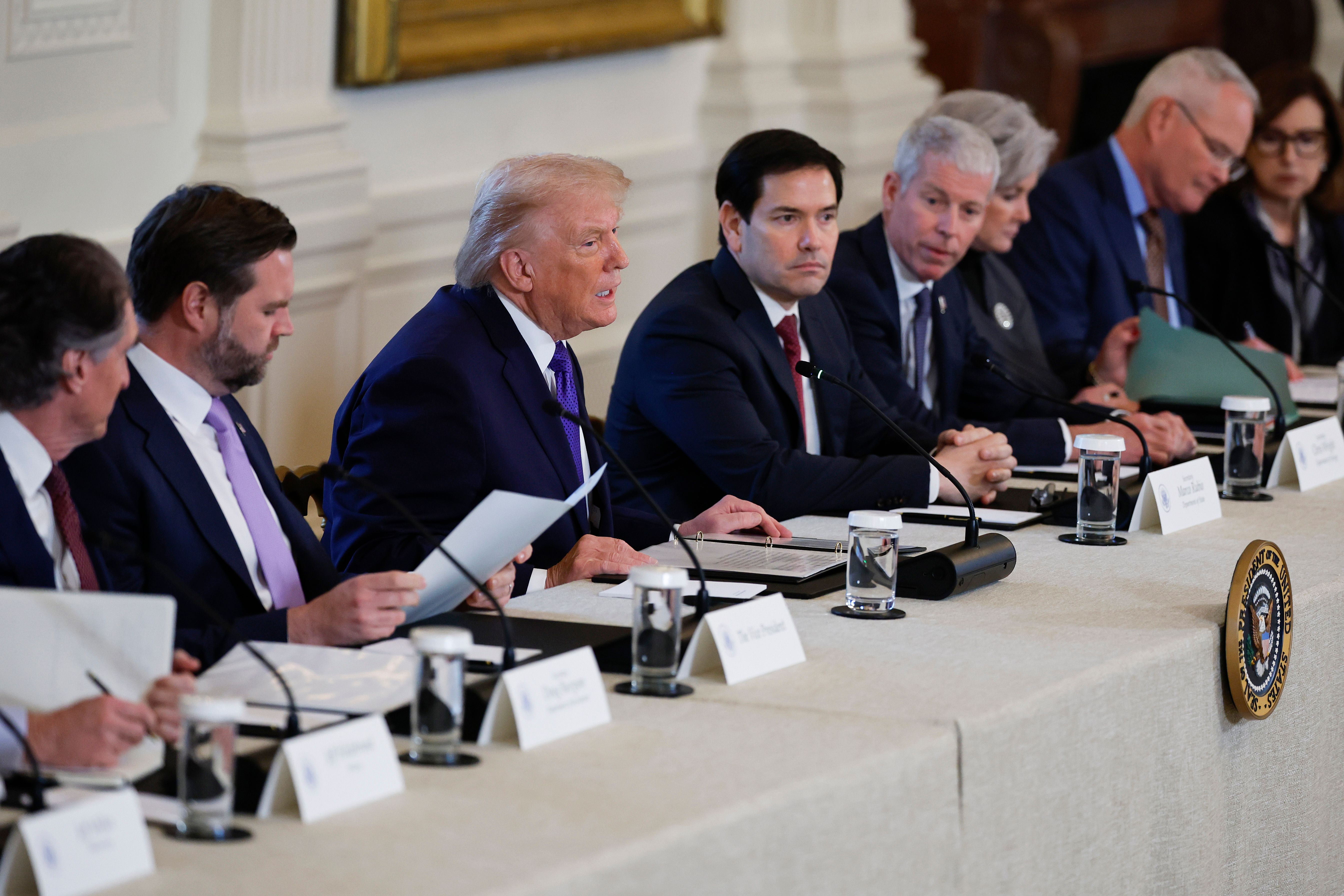US President Donald Trump (C-L) and Secretary of State Marco Rubio.