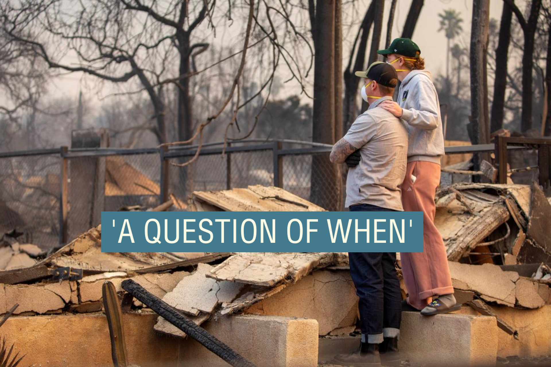 People return to the home after it has been burned down by wildfires in the Los Angeles area, at the Eaton Fire in Altadena, California