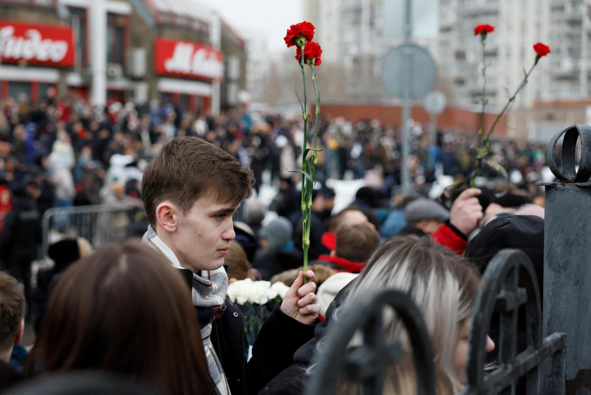 People gather near the church where a funeral service for Navalny is held in Moscow