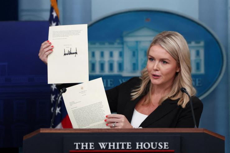 White House Press Secretary Karoline Leavitt shows a signed letter on tariffs from U.S. President Donald Trump to South Korean President Lee Jae Myung.