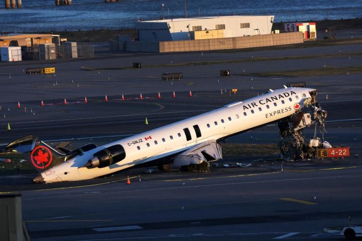 The wreckage of an Air Canada Express jet that collided with a ground vehicle at New York’s LaGuardia Airport on Monday in Queens, New York, U.S.