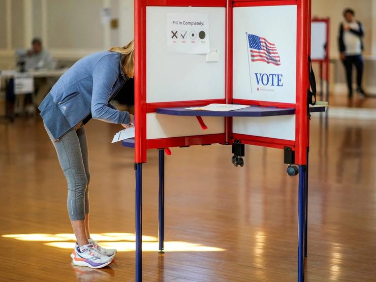 A person voting