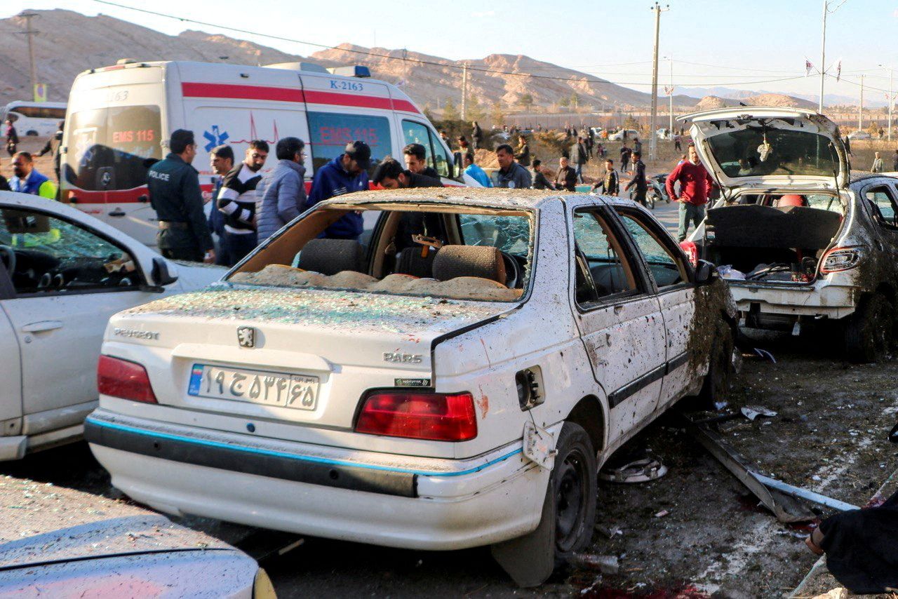 People gather at the scene of explosions during a ceremony held to mark the death of late Iranian General Qassem Soleimani, in Kerman, Iran, January 3, 2024