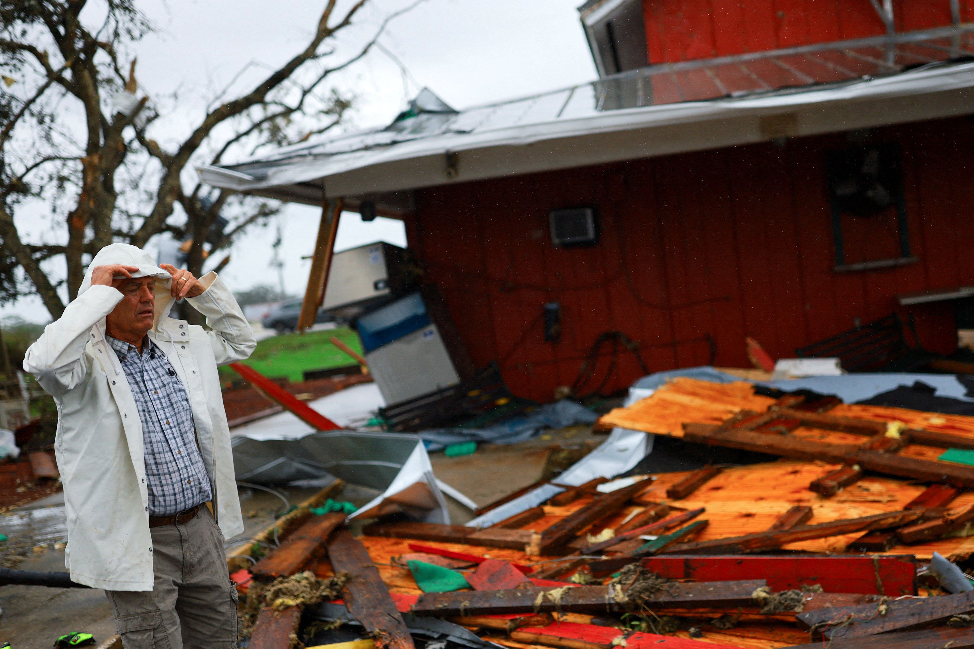 Jeff Schorner walks next to his business, Al’s Family Farms, which he lost during Hurricane Milton, in Lakewood Park, Florida