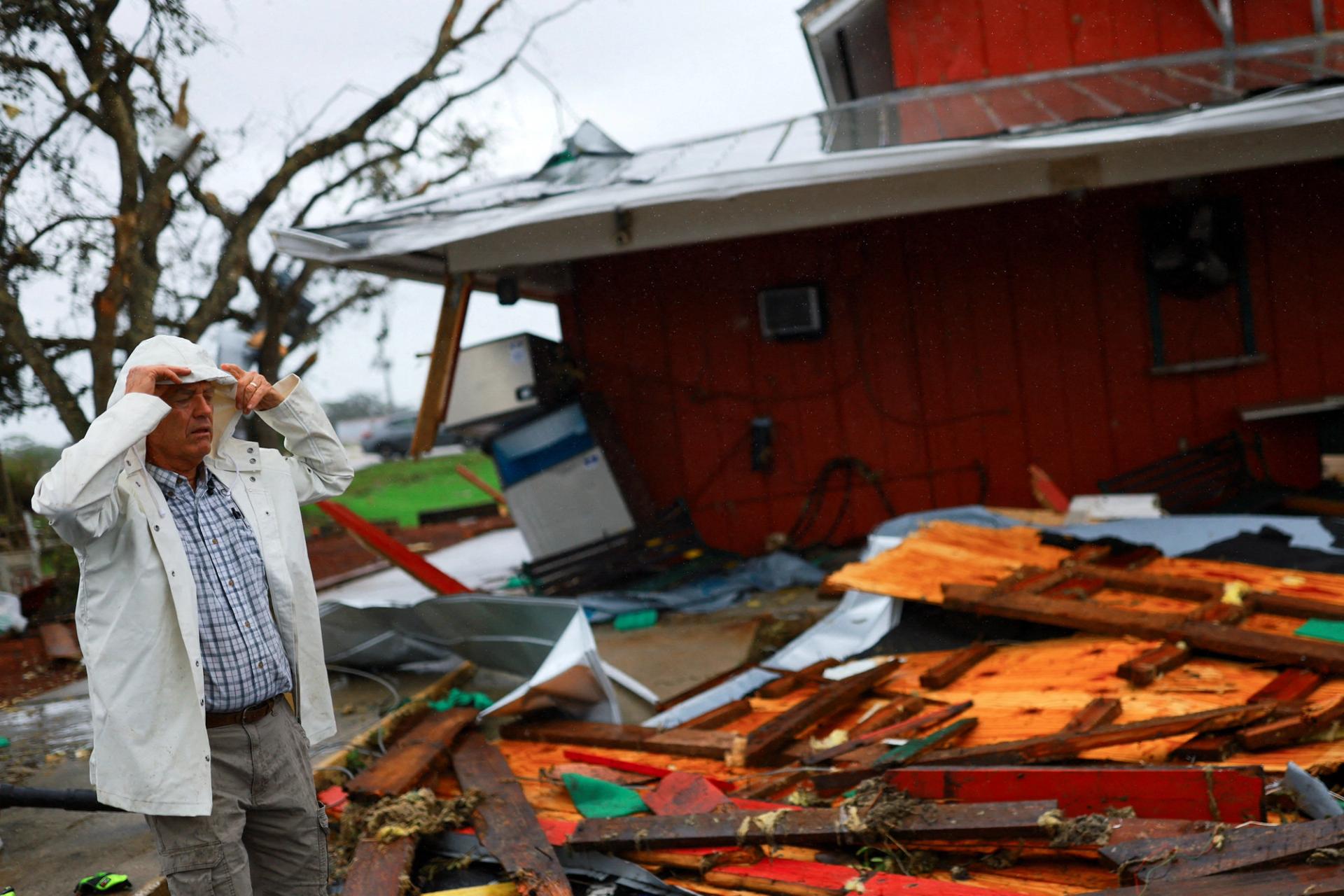 Jeff Schorner walks next to his business, Al’s Family Farms, which he lost during Hurricane Milton, in Lakewood Park, Florida