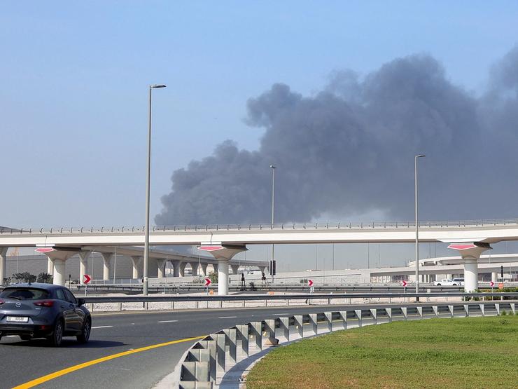 Smoke billows from Jebel Ali port after an Iranian attack.