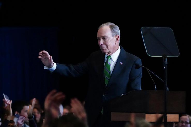 Mike Bloomberg waves to supporters in New York