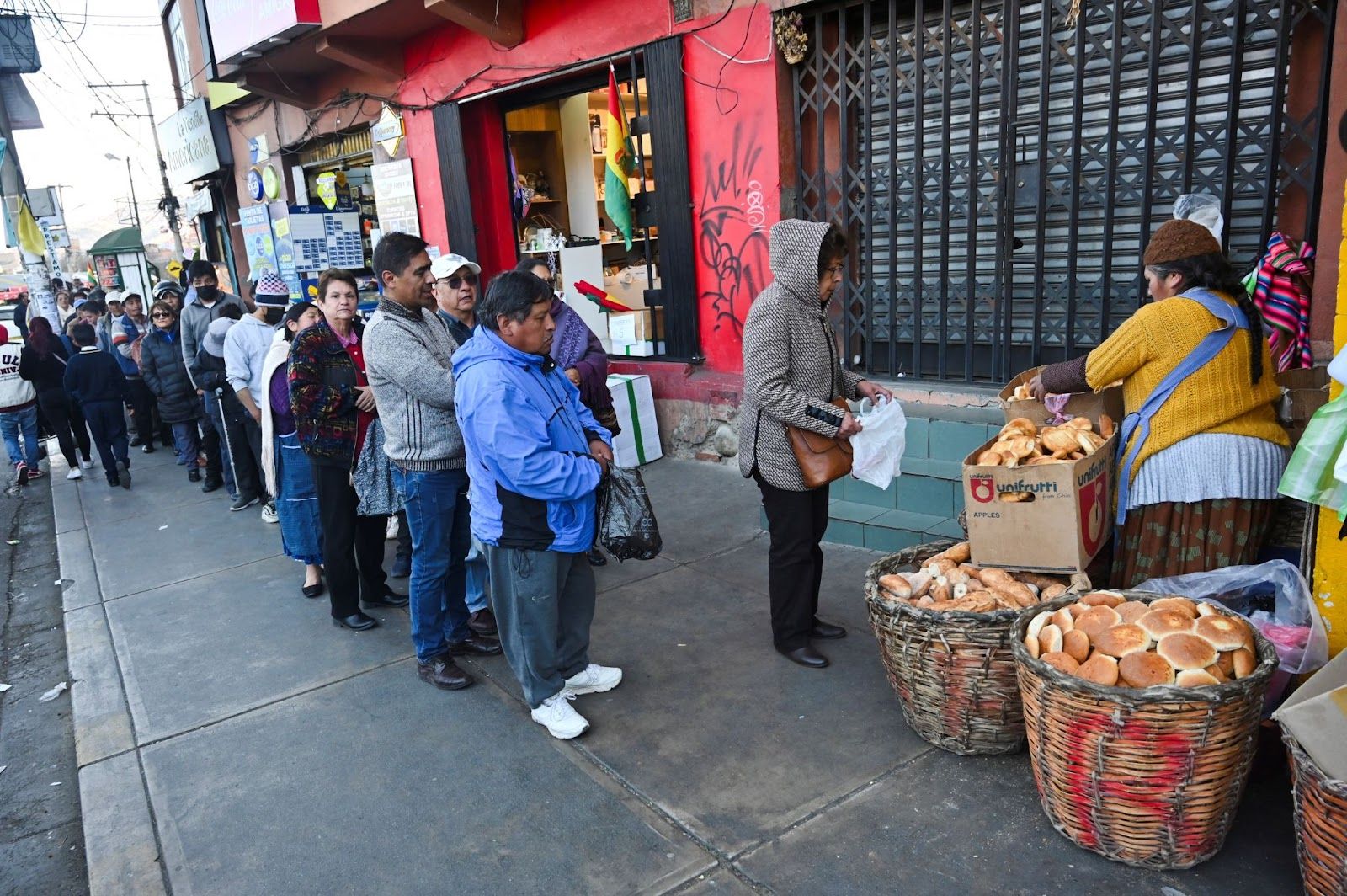 People in Bolivia queuing to buy Battle Bread. 