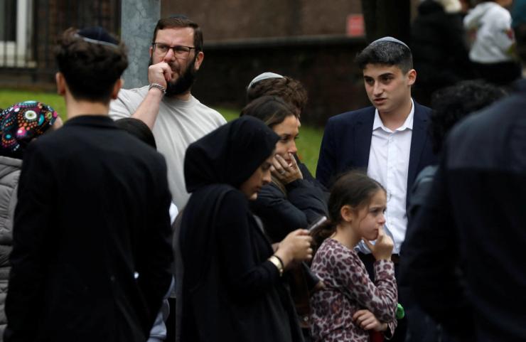 People gather near the attack in Manchester.