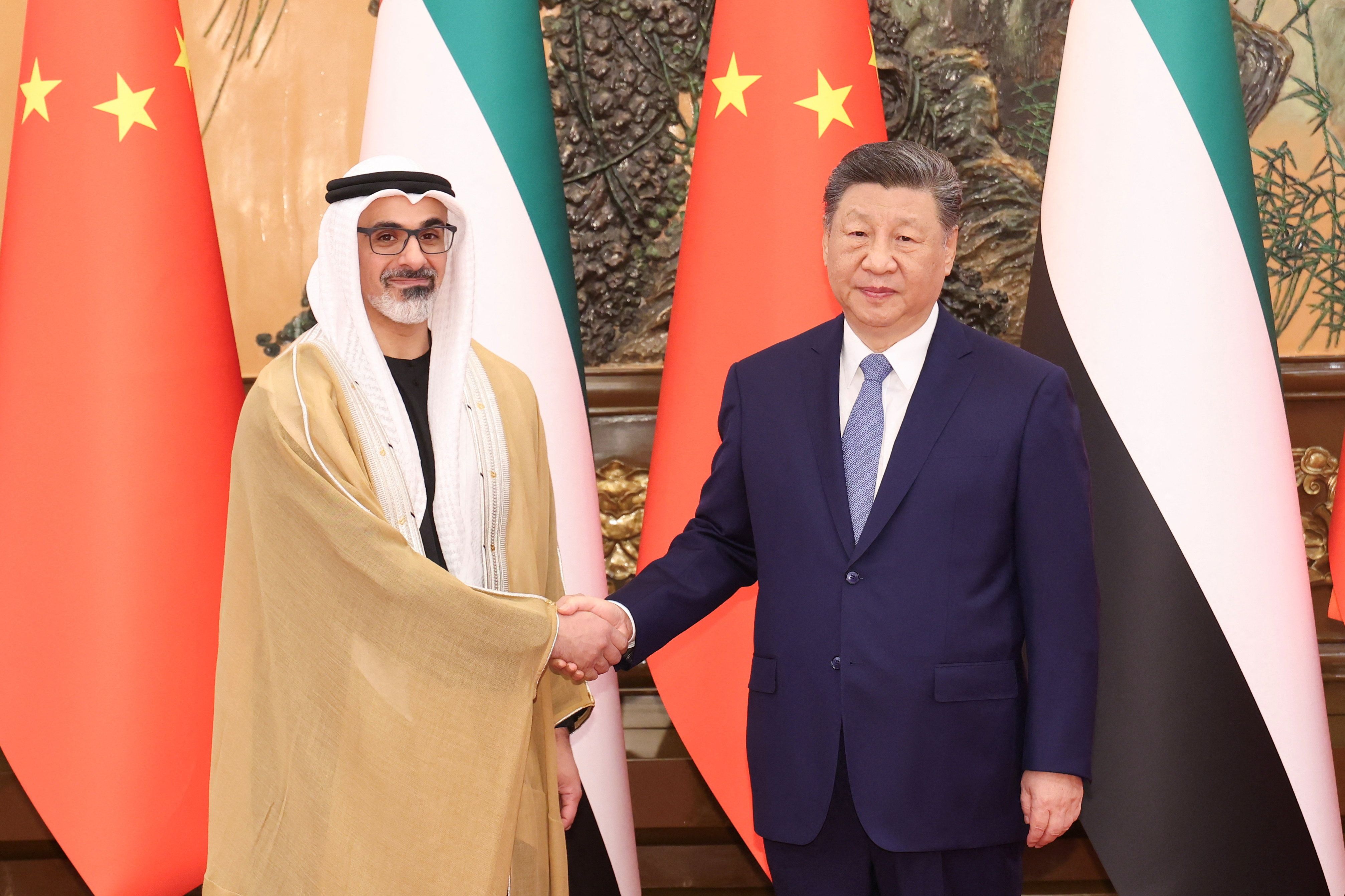 China’s President Xi Jinping shakes hands with Sheikh Khaled bin Mohamed bin Zayed Al Nahyan.