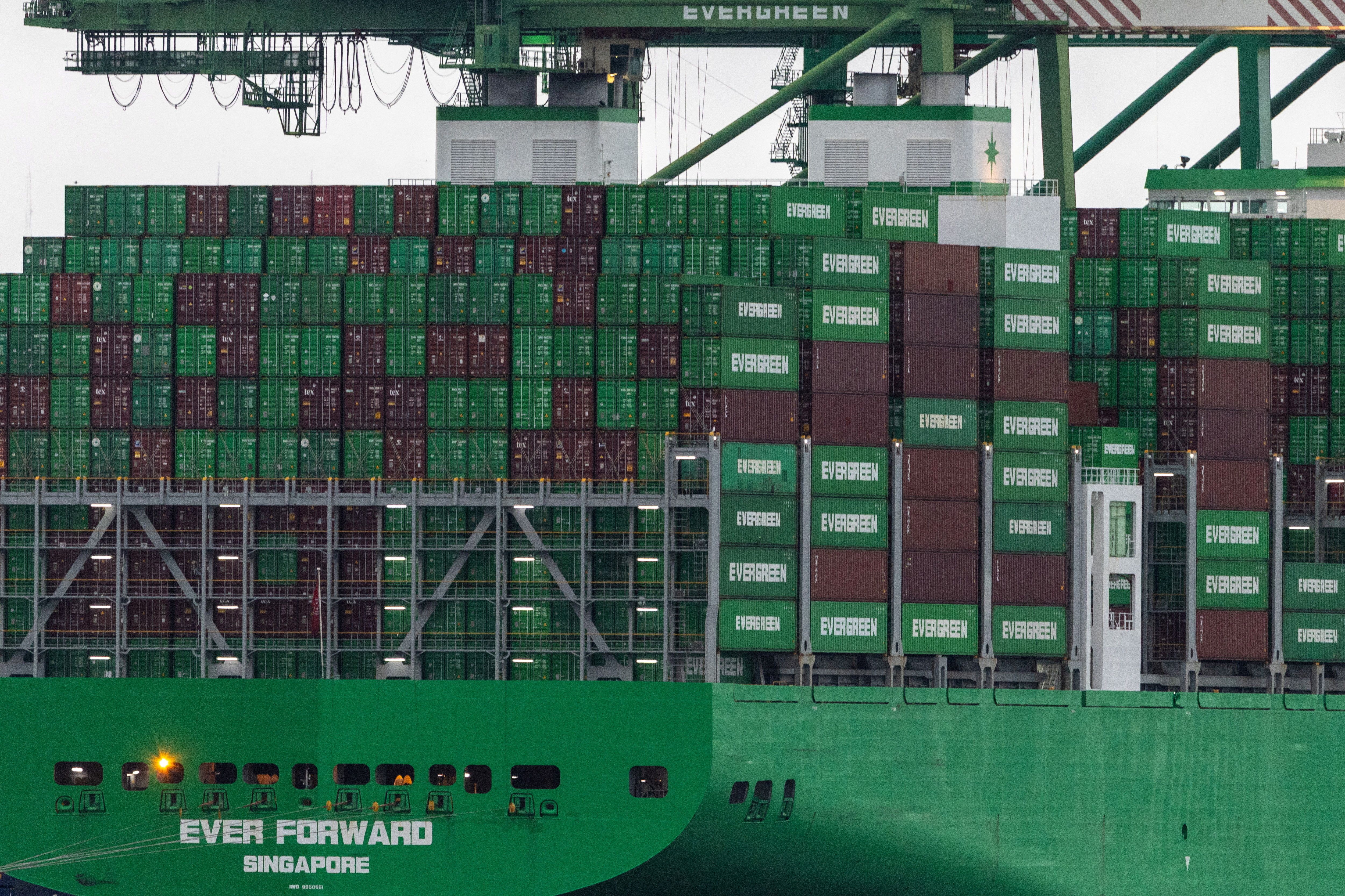 A cargo ship with stacked shipping containers