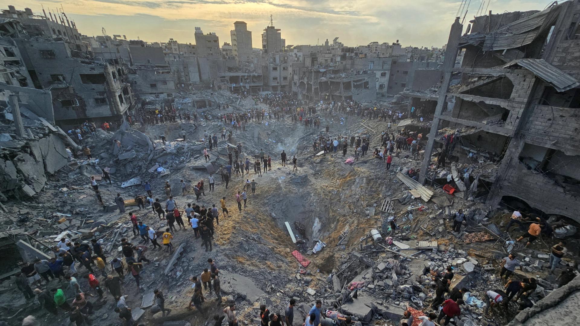 Palestinians search for casualties at the site of a blast in the Jabalia refugee camp in the northern Gaza Strip, October 31, 2023.