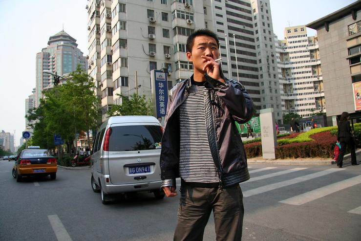 A Chinese man smoking.