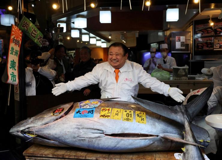 Kiyomura Co.’s President Kiyoshi Kimura, who runs a chain of sushi restaurants Sushi Zanmai, poses with a 243-kilogram bluefin tuna auctioned for a record 510 million yen ($3.24 million) at the first auction of 2026 at Tokyo’s Toyosu fish market, at his sushi restaurant in Tokyo, Japan