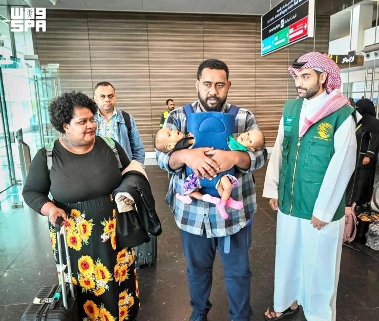 Fijian twins Jesibel and Desisia arrive in Riyadh, Saudi Arabia with their parents, on July 31