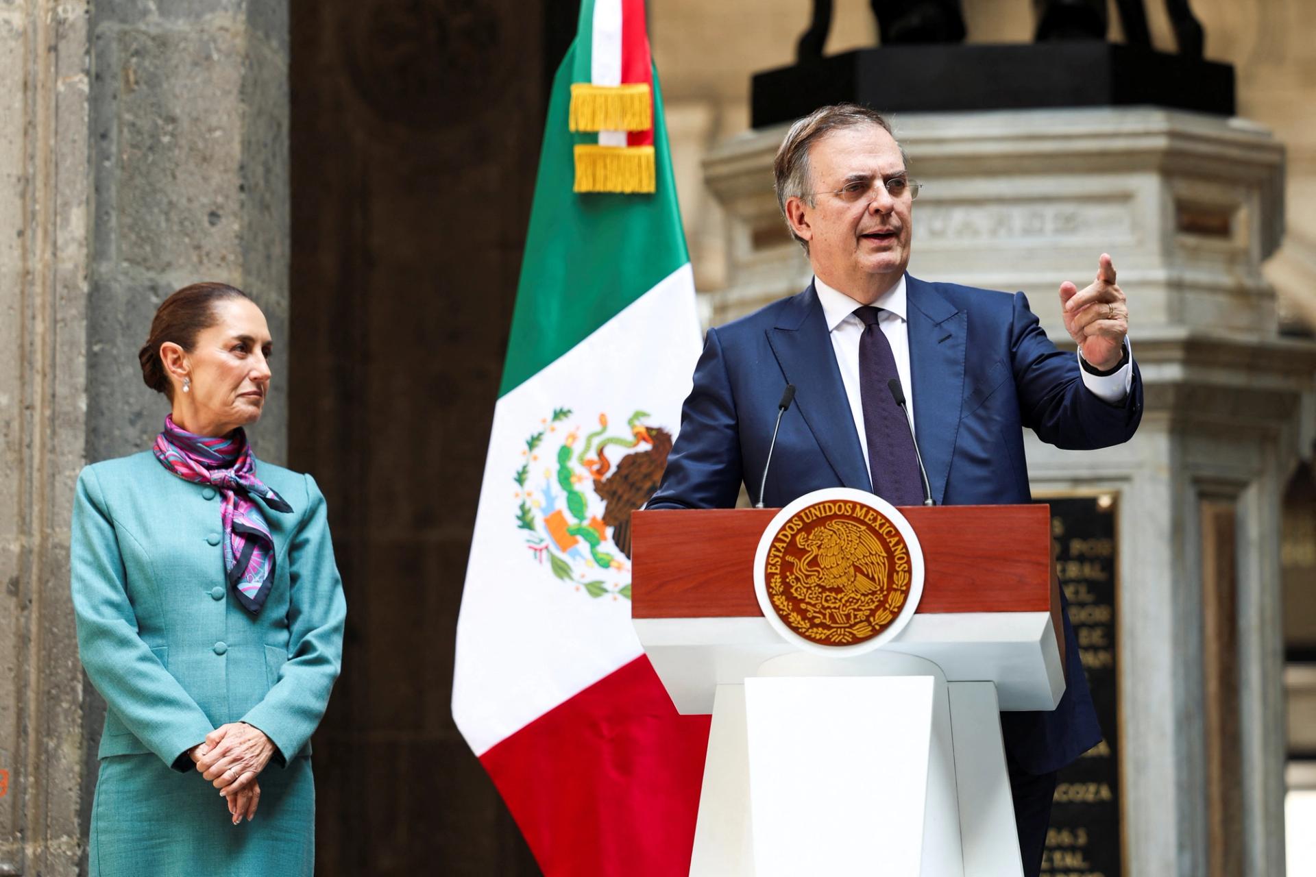 Mexican Minister of Economy Marcelo Ebrard speaks during a press conference next to Mexican President Claudia Sheinbaum.