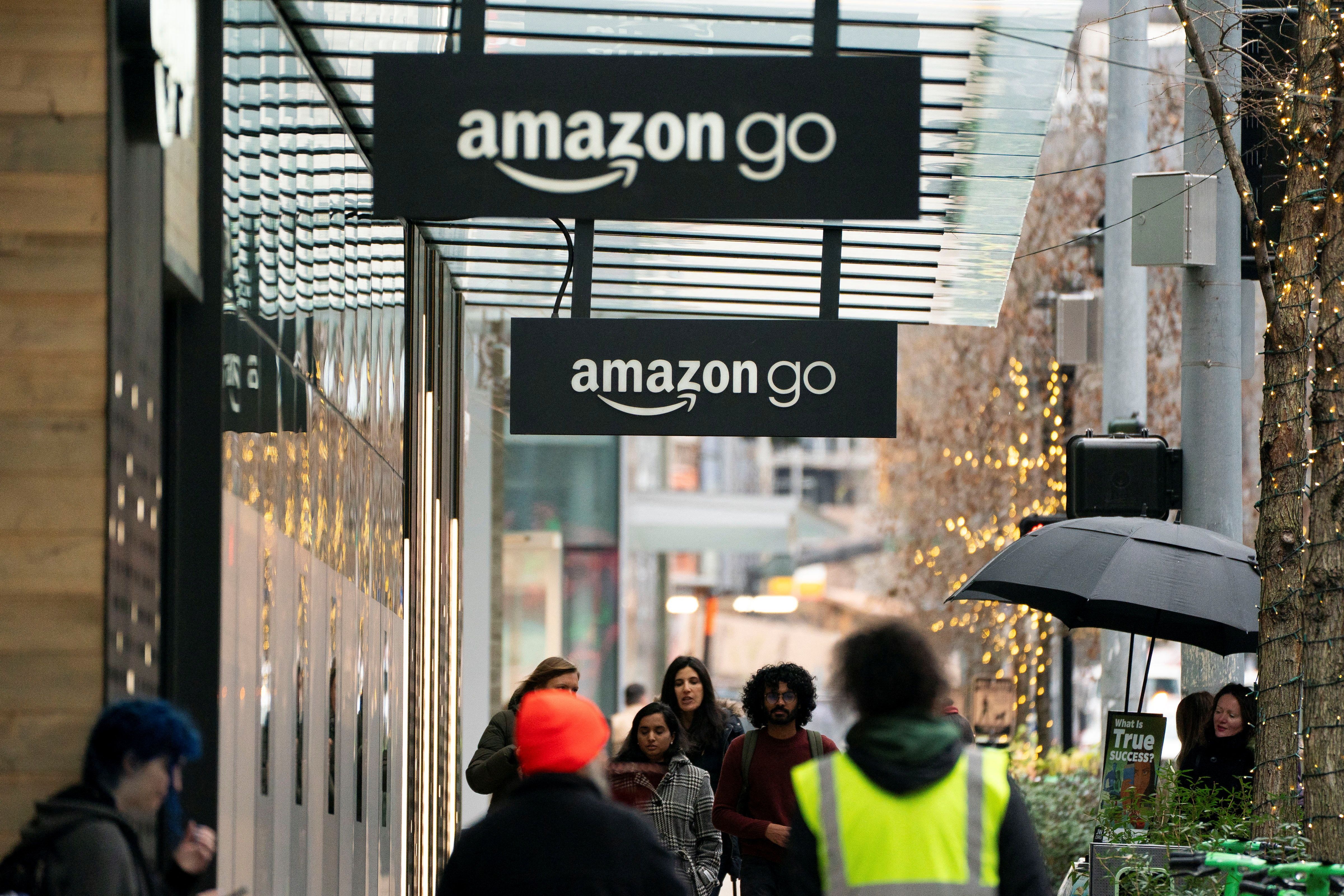 Signage for Amazon Go, outside of a retail location set to close, at a building on Amazon’s headquarters campus in Seattle.
