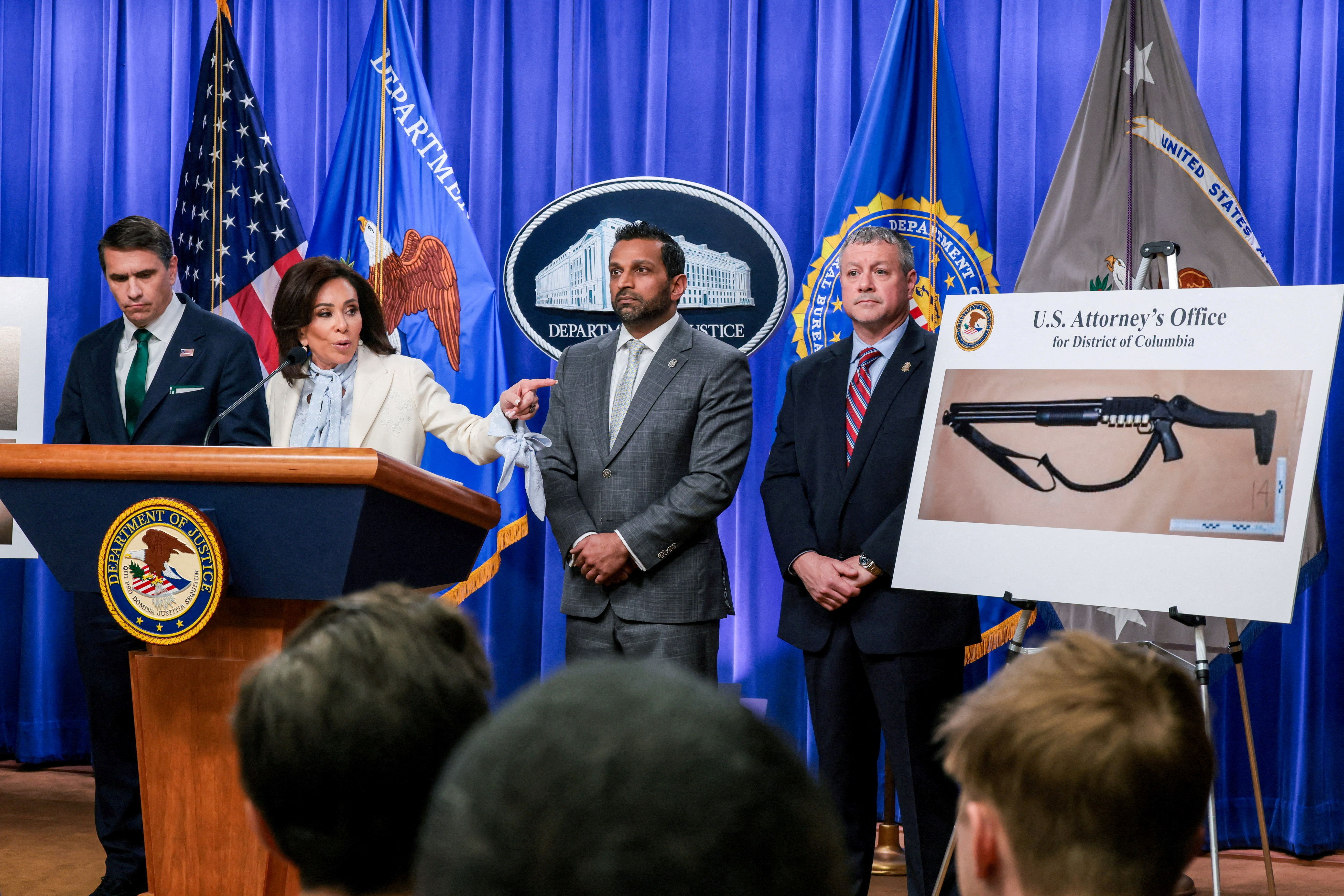 U.S. Attorney for the District of Columbia Jeanine Pirro points at a picture of a shotgun carried by Cole Tomas Allen, the suspect in the shooting incident in Washington at the annual White House Correspondents’ Association dinner, as she and acting Attorney General Todd Blanche, U.S. Federal Bureau of Investigation (FBI) Director Kash Patel, Assistant Director in Charge (ADIC) of the FBI Washington Field Office Darren Cox take part in a press conference