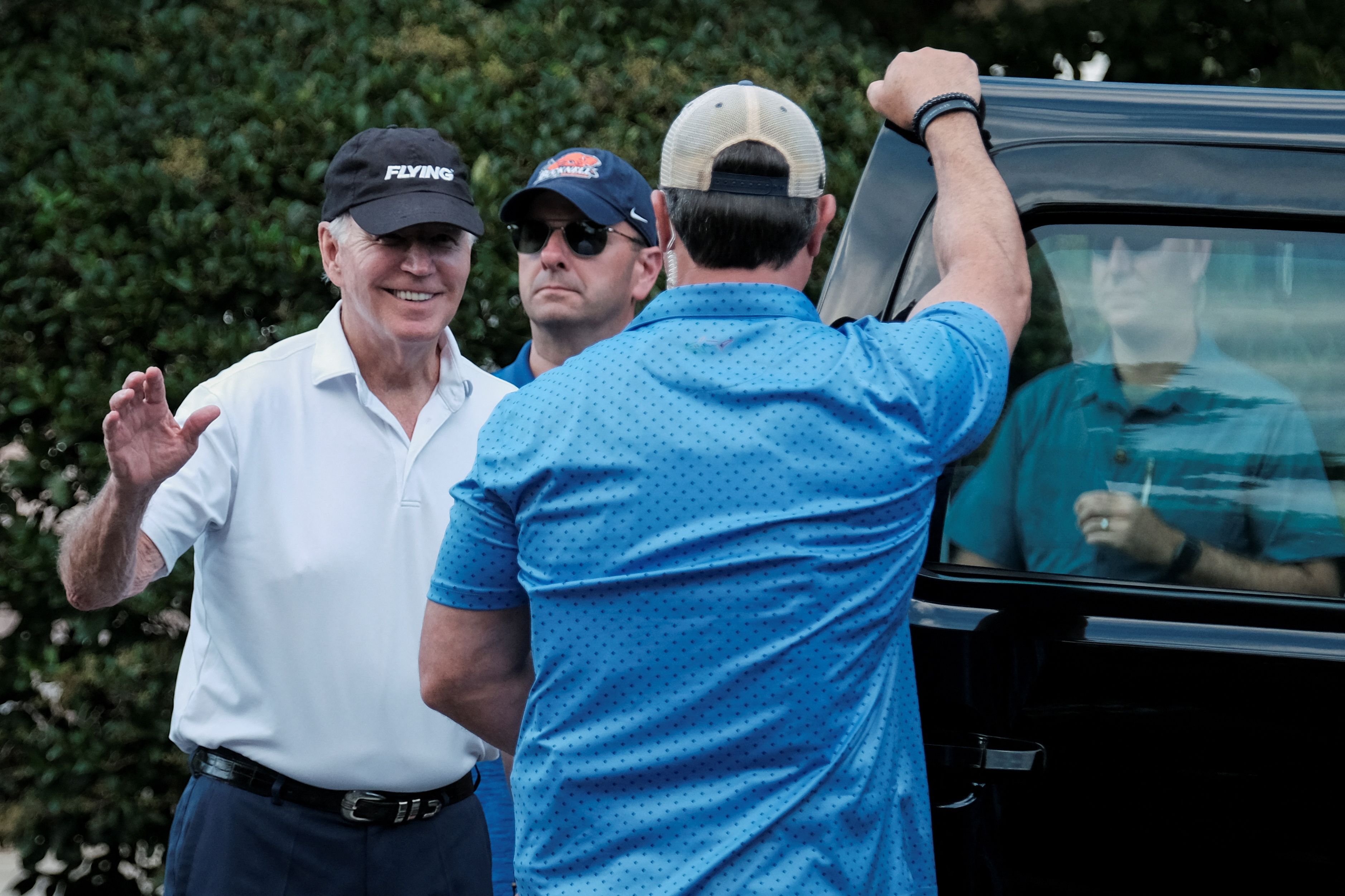 U.S. President Joe Biden waves as he departs North Shores Beach in Rehoboth Beach, Delaware, U.S., August 13, 2023.