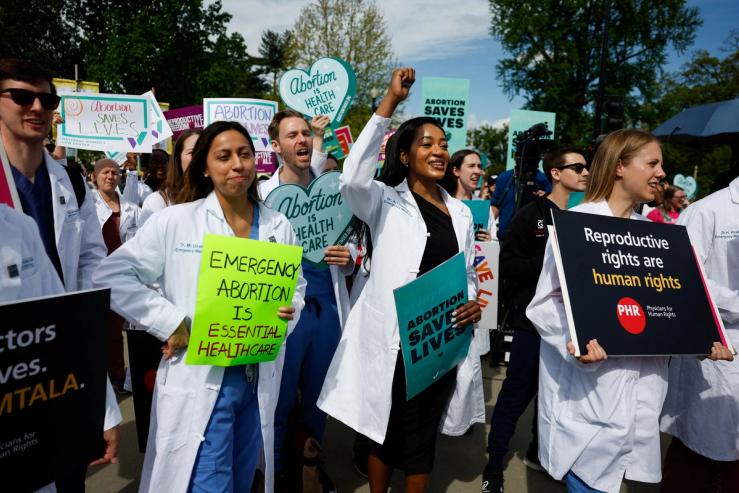 People gather for a protest outside the Supreme Court in support of reproductive rights and emergency abortion care on April 24, 2024.