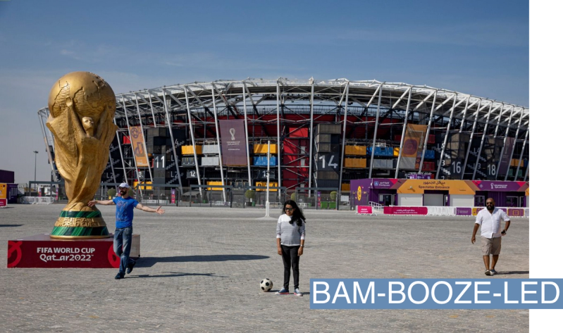 General view of a giant replica World Cup as fans are seen outside the stadium ahead of the FIFA World Cup Qatar 2022.