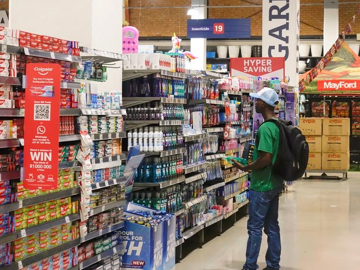 A customer shops for groceries at a market in Johannesburg.