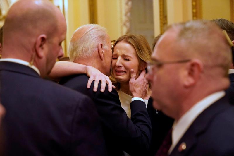 President Joe Biden hugs Brittany Alkonis on the day of the State of the Union address to a joint session of Congress at the Capitol, Tuesday, Feb. 7, 2023, in Washington.
