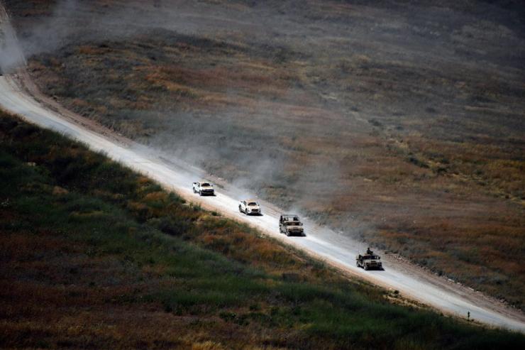 Israeli military vehicles on a road in Lebanon.