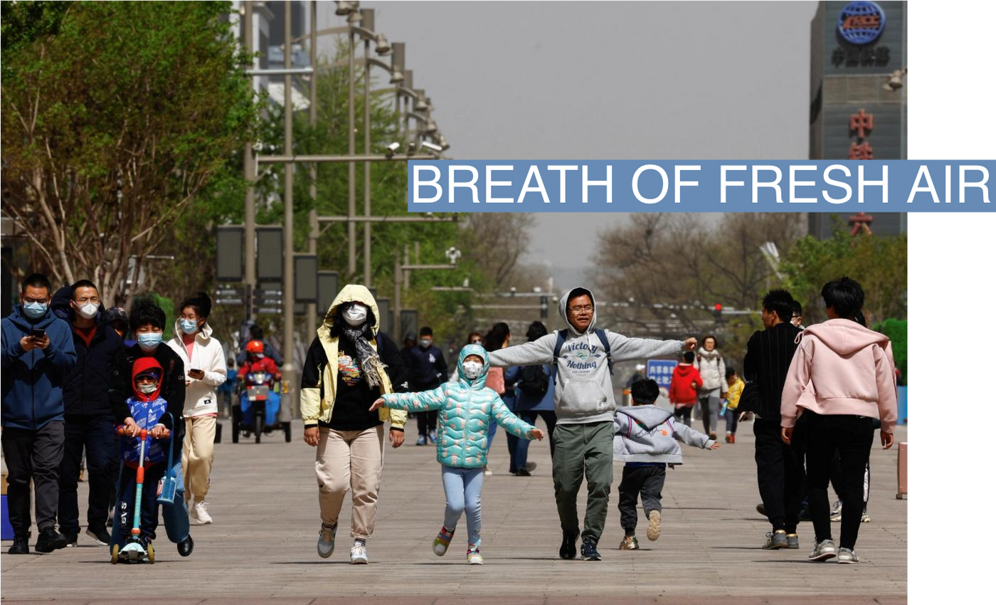 People walk against the wind amid a sandstorm in Beijing, China April 11, 2023. REUTERS/Tingshu Wang