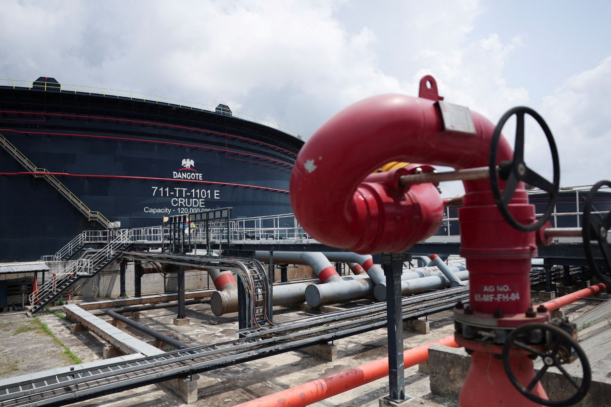 A Dangote crude oil tank is seen inside the Dangote Industries oil refinery. 