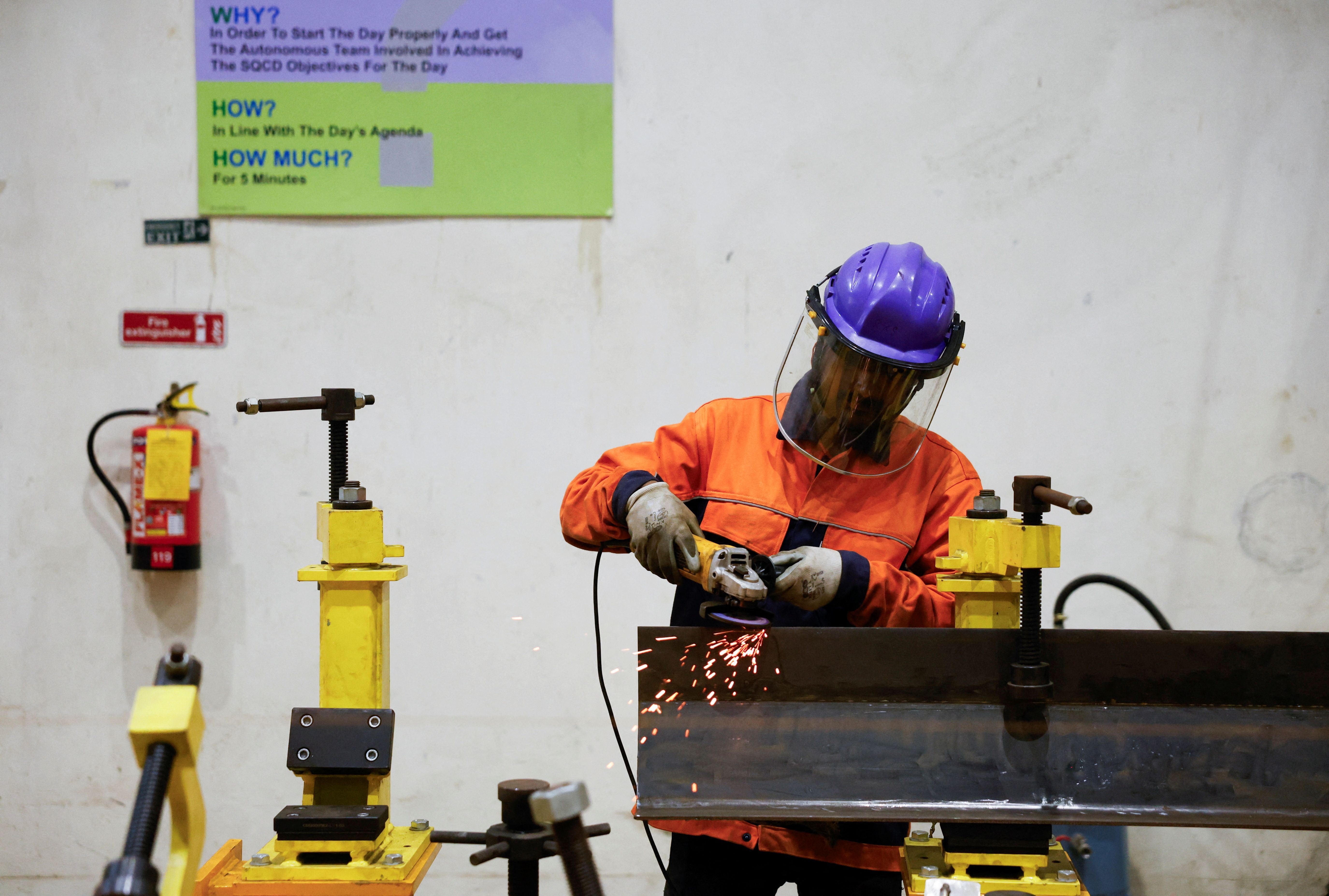 A worker at a rail manufacturer in Uttarpara, India.