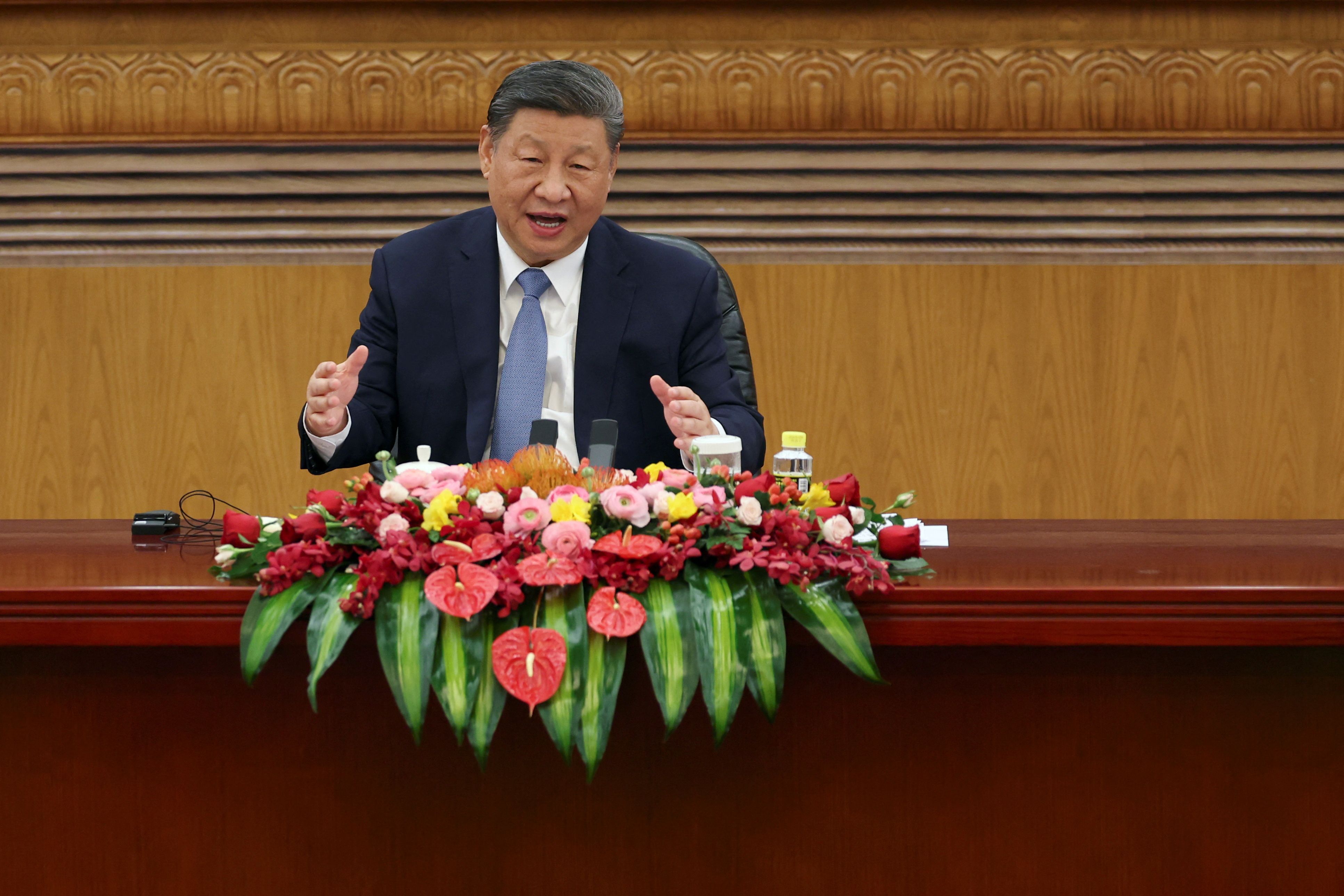 China’s leader Xi Jinping speaks at a meeting with foreign business leaders at the Great Hall of the People in Beijing.