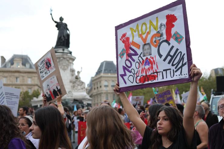 Women rally to support women’s right to abortion on Sept. 28, 2023, in Paris.