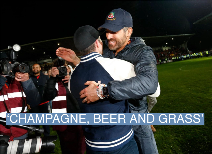 Wrexham co-owners Rob McElhenney and Ryan Reynolds celebrate on the pitch after the match as Wrexham win the National League and promotion to League Two Action Images via Reuters/Ed Sykes