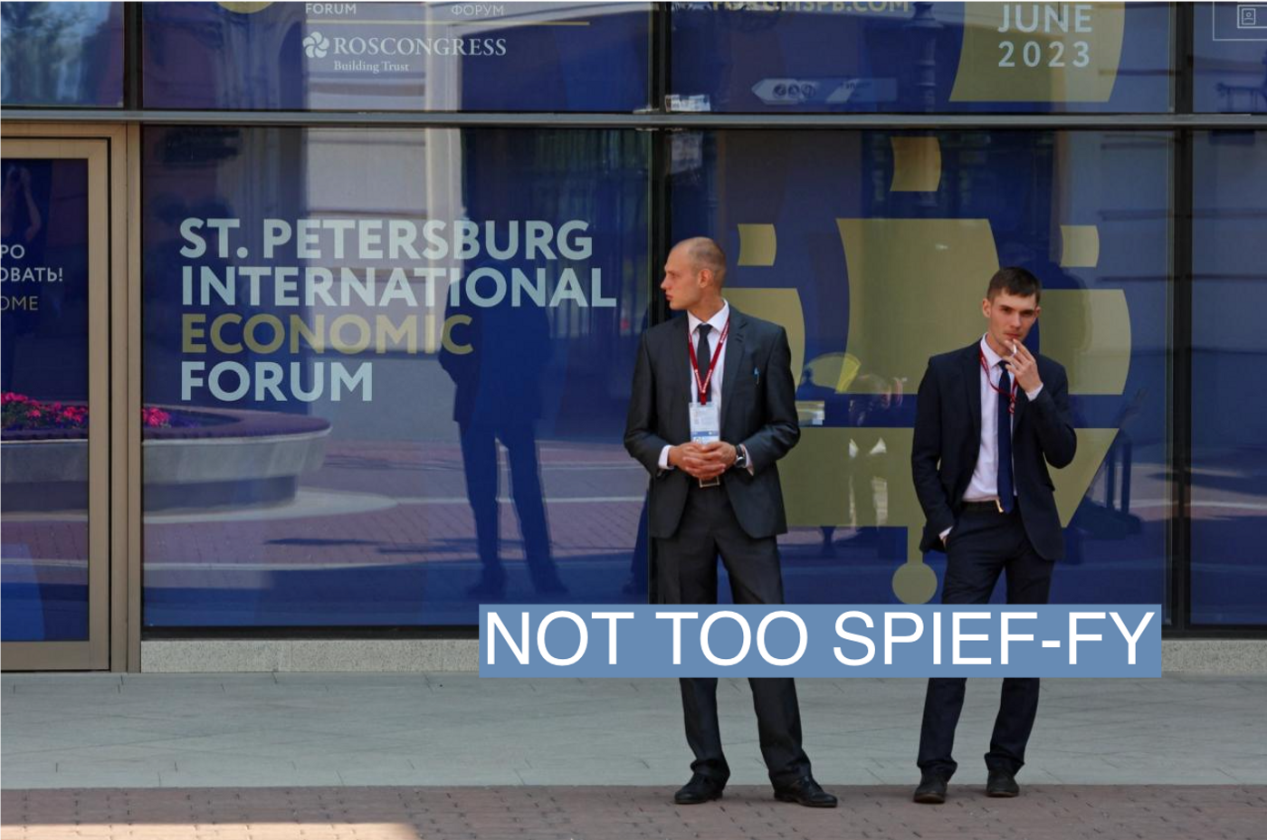 Men stand outside the accreditation centre for participants of the St. Petersburg International Economic Forum (SPIEF) and media representatives in Saint Petersburg, Russia June 14, 2023. REUTERS/Anton Vaganov
