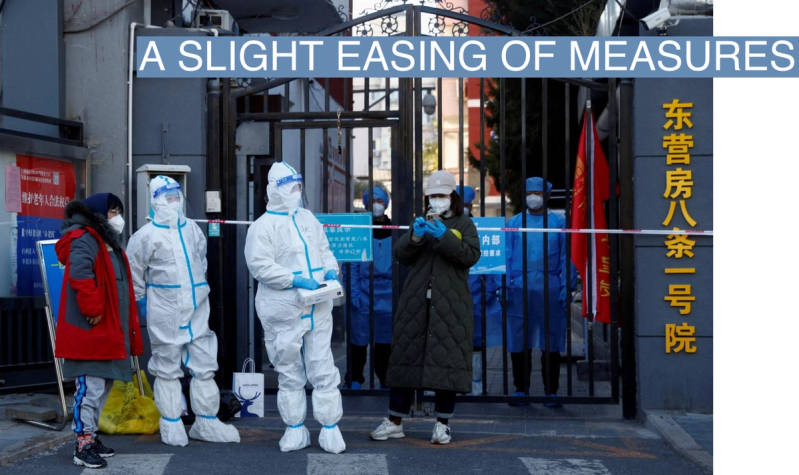 Security personnel in protective suits stand at the gate of a residential compound that is under lockdown as outbreaks of coronavirus disease (COVID-19) continue in Beijing, October 22, 2022.