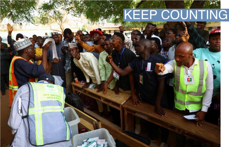 Party agents react during the counting of ballots, after voting ended, at a polling station, in Nigeria’s presidential election, in Yola, Nigeria, February 25, 2023.