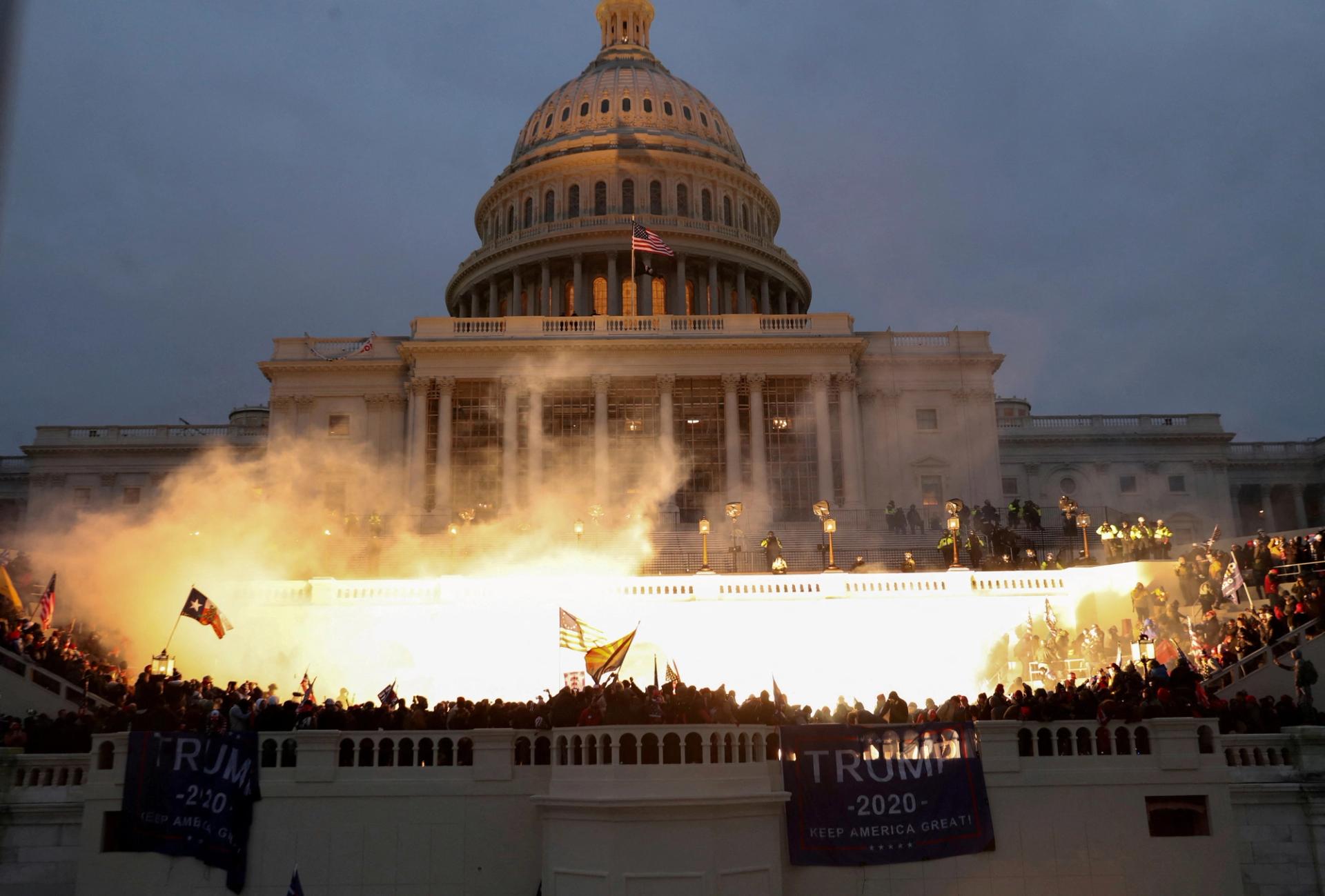 An explosion caused by a police munition is seen while supporters of U.S. President Donald Trump gather in front of the U.S. Capitol Building in Washington, D.C., on Jan. 6, 2021. 