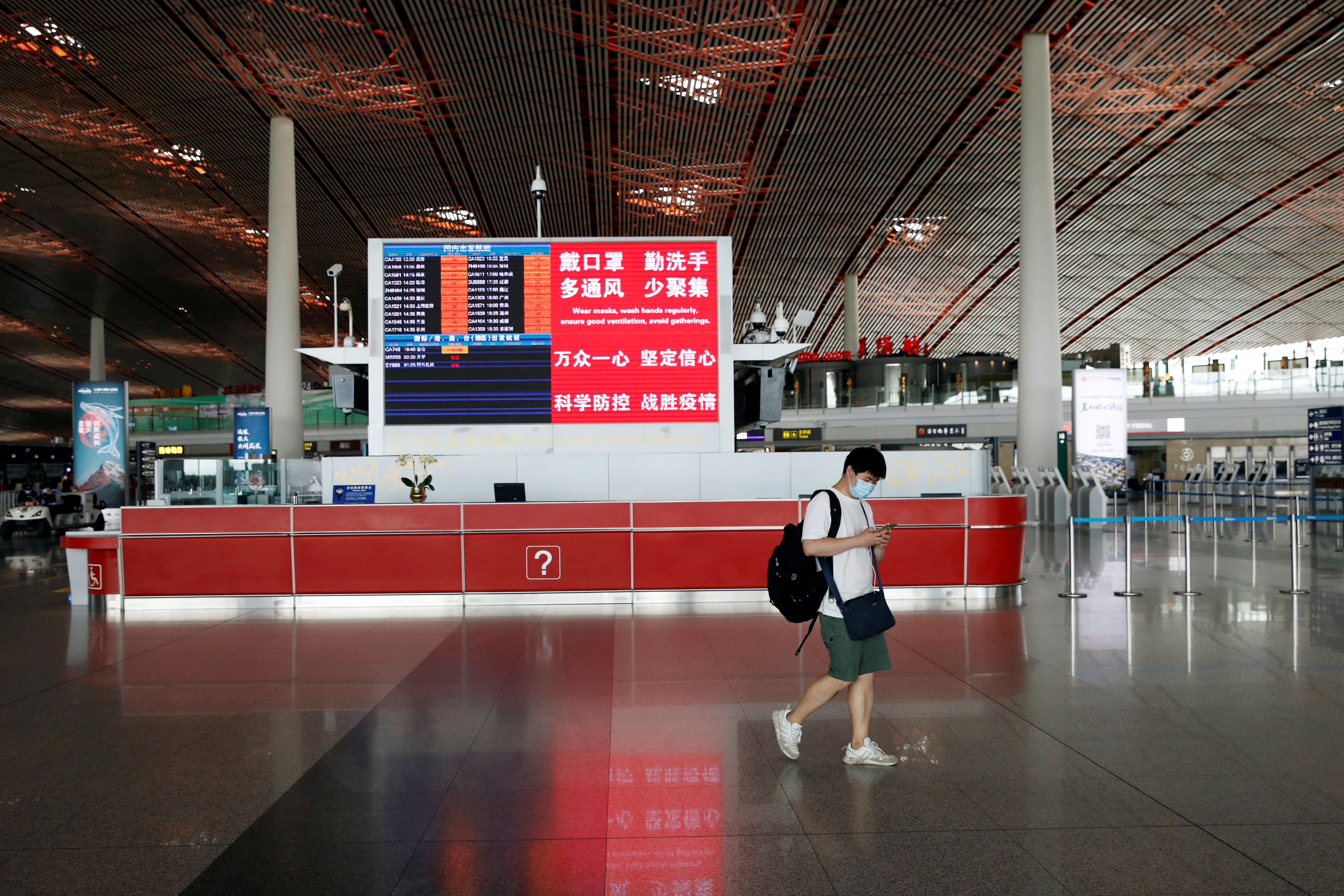 A man wearing a face mask in Beijing Capital International Airport.