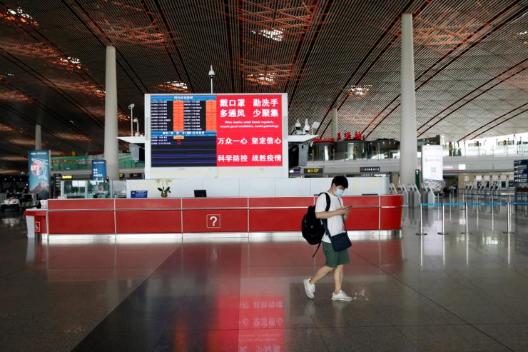 A man wearing a face mask in Beijing Capital International Airport.