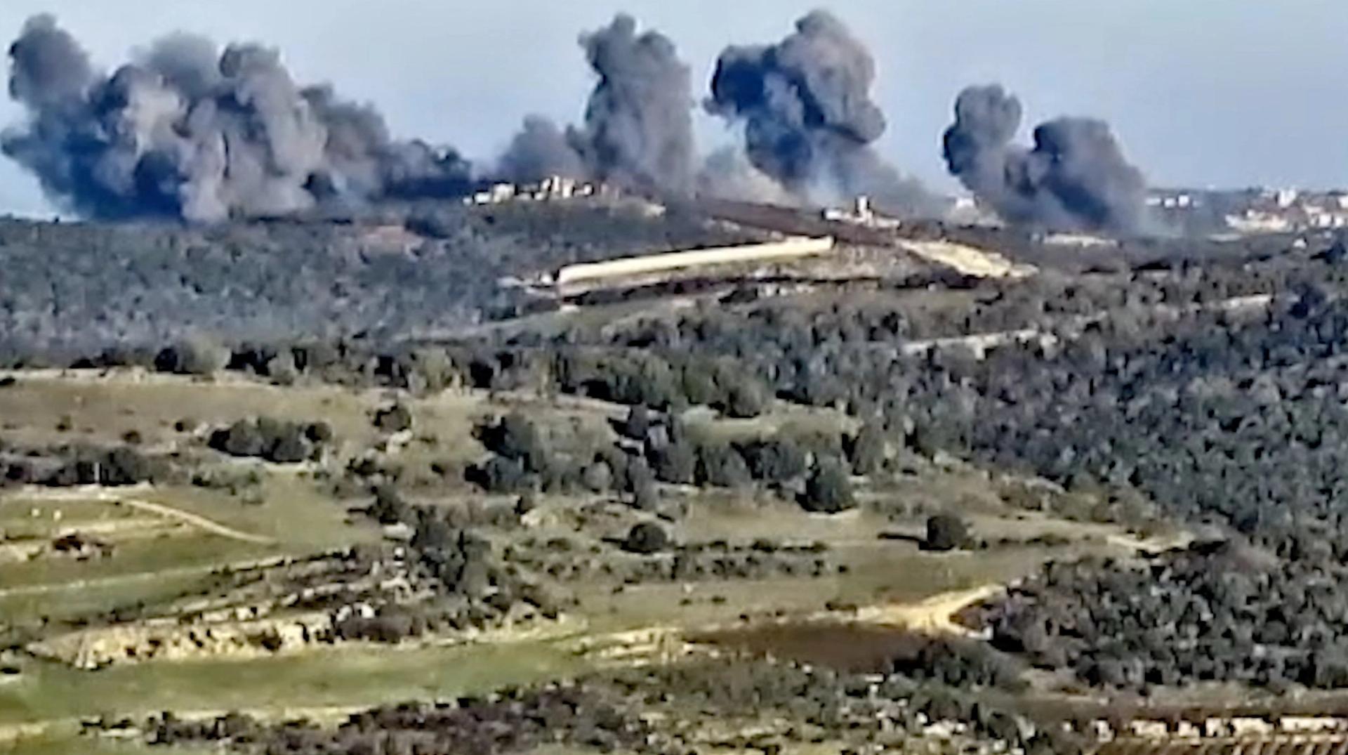 Smoke rises following what the Israeli military says is an Israeli strike on Hezbollah targets in a location given as Lebanon, amid the ongoing cross-border hostilities between Hezbollah and Israeli forces, in this screengrab taken from a handout video released on December 20, 2023. Israel Defense Forces/Handout via REUTERS