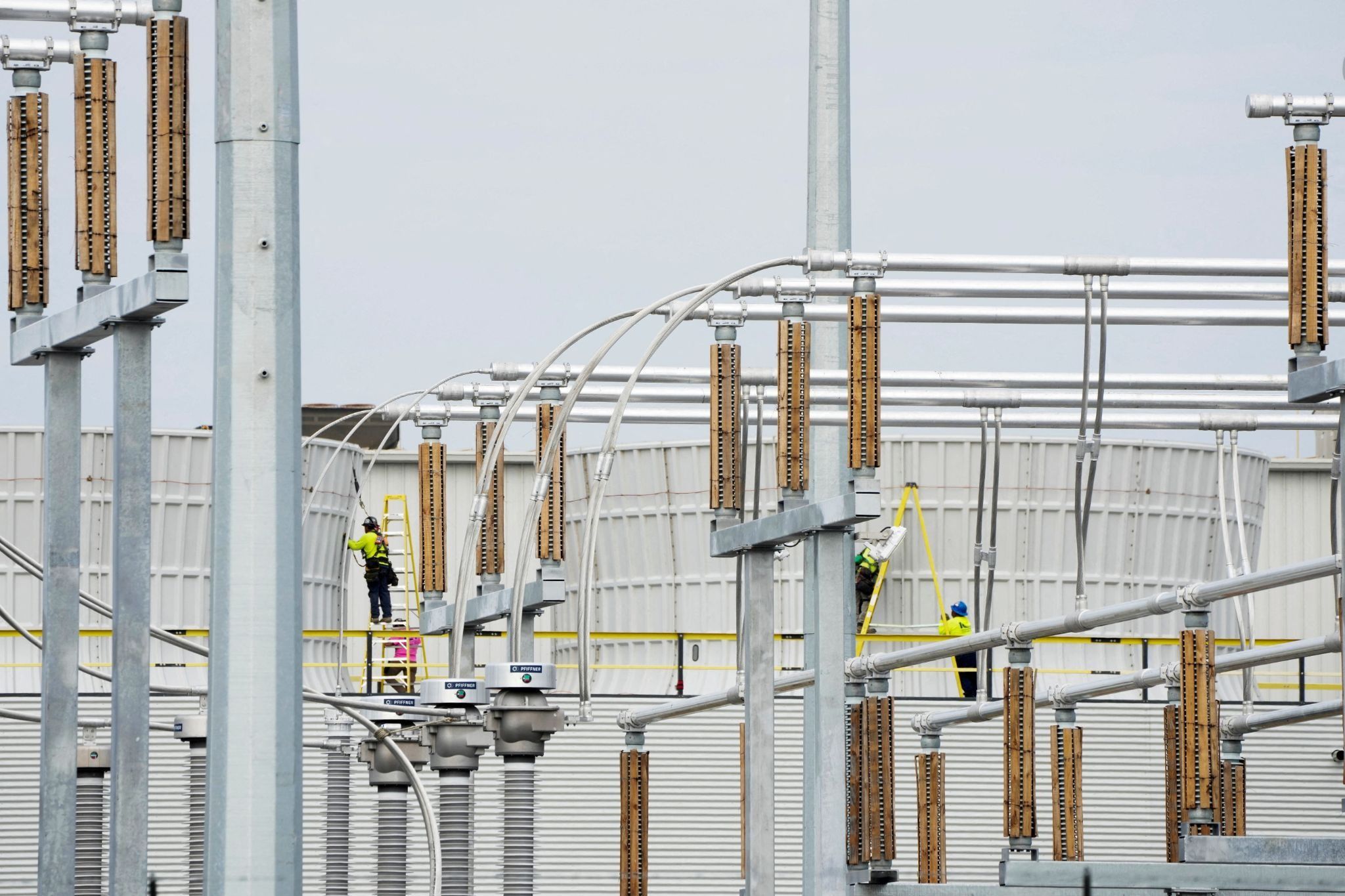 : Workers at Elon Musk’s xAI facility, which houses a large supercomputer known as Colossus. 