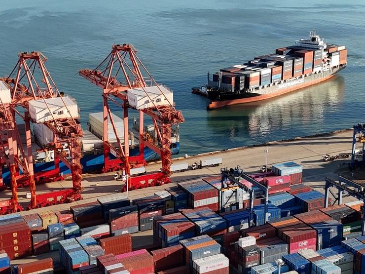 A drone view shows a cargo ship approaching a container terminal at Lianyungang port, China Oct. 14, 2026