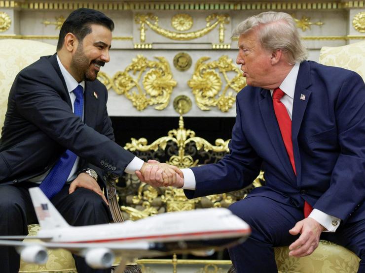 President Donald Trump shakes hands with Iraqi Prime Minister Ali al-Zaidi