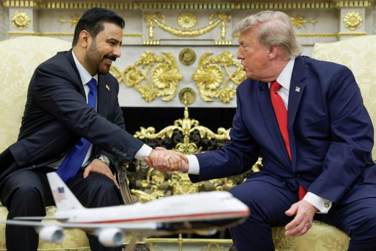 President Donald Trump shakes hands with Iraqi Prime Minister Ali al-Zaidi