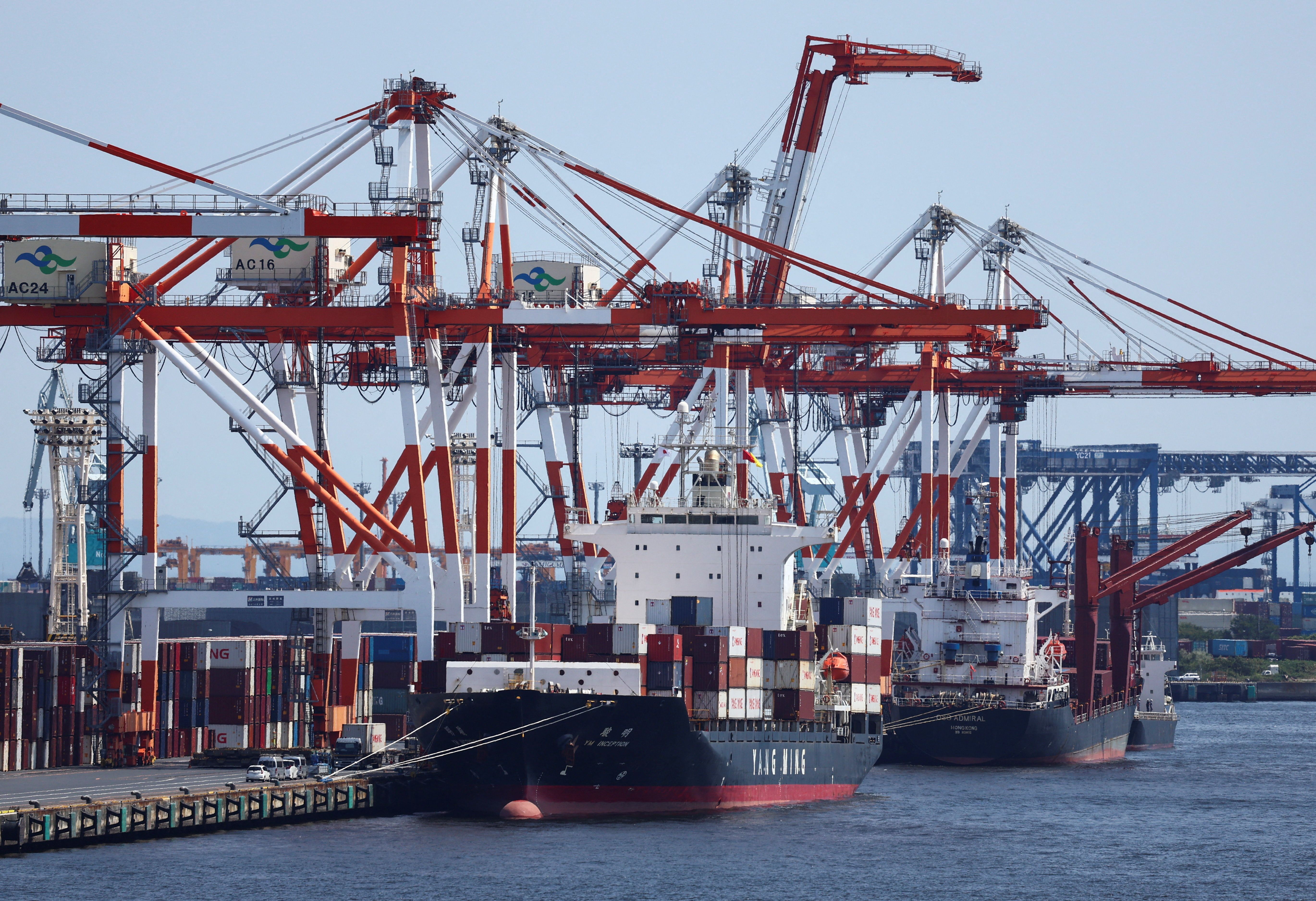 A cargo ship carrying containers is seen at an industrial port within Tokyo Port, Japan