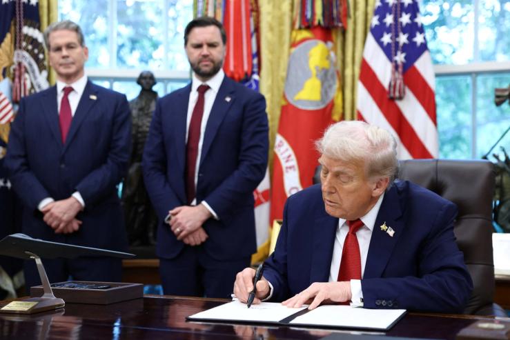US President Donald Trump signs an executive order on a deal that would divest TikTok’s US operations from ByteDance.