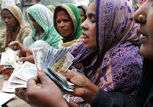 A Bangladeshi woman handles cash